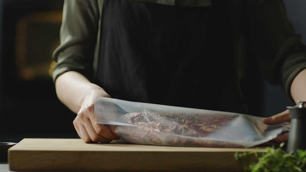 A chef preparing a sous vide steak